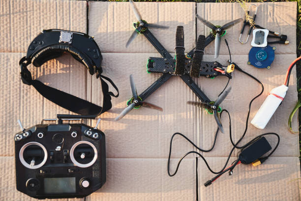 istock Assembling a Racing Drone With Custom Parts and Controllers at Sunset in an Urban Workspace 2165715813