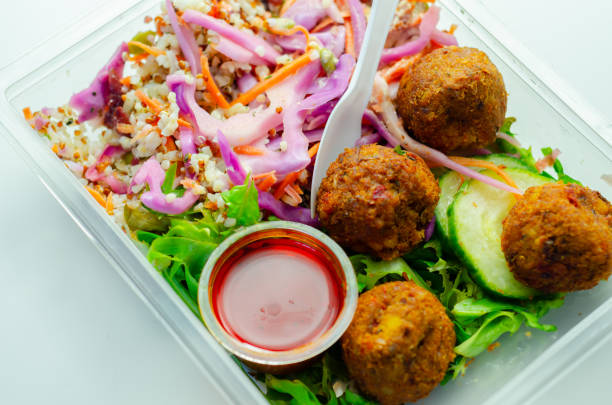 istock A salad with meatballs and a dipping sauce 2165716026