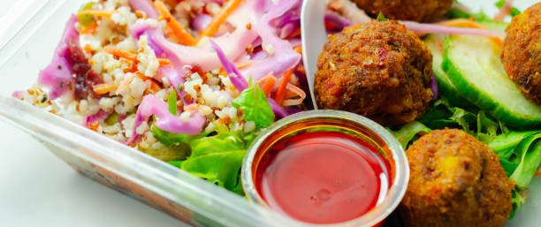 istock A salad with meatballs and a dipping sauce 2165716281