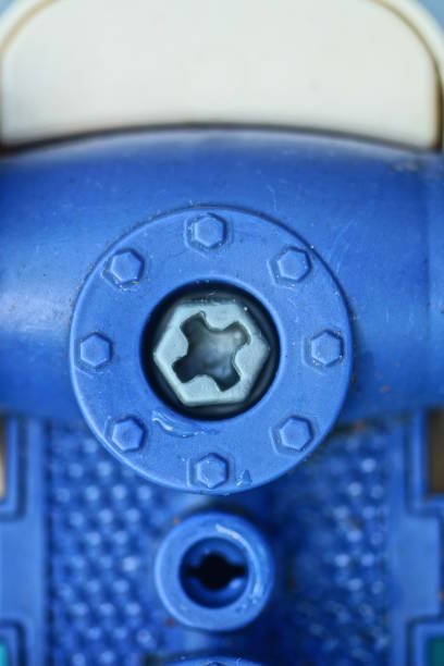 istock bolt screwed into a piece of blue plastic toy 2165716326