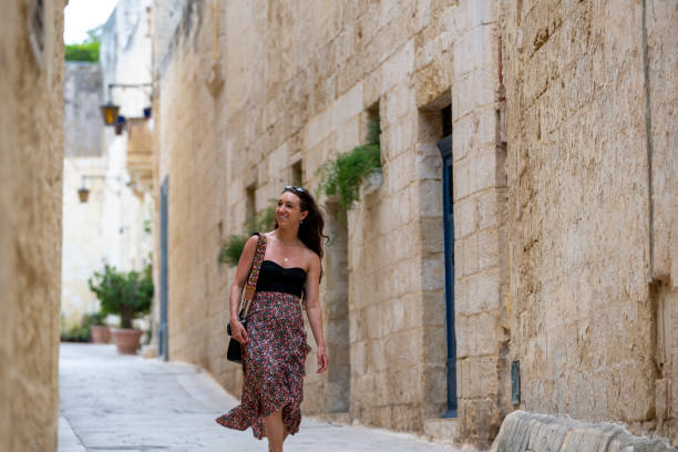 istock Woman explores old town streets, Rabat 2165719240