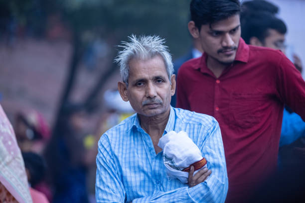 Ghaziabad, Uttar Pradesh, India - November 2023: Chhath Puja, Portrait of hindu male at chhath grond enjoying the festival of chhath with their families.