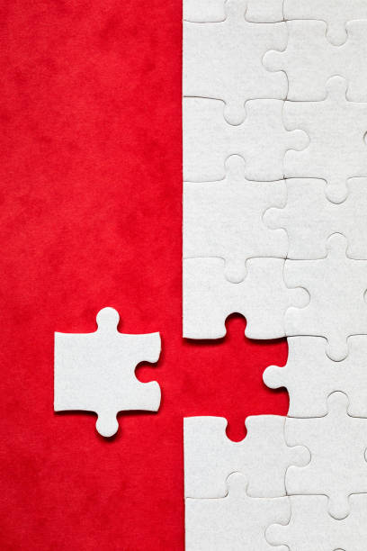 istock White jigsaw puzzle. White puzzle pieces on color background. Unfinished white jigsaw puzzle pieces on color background. 2165722859