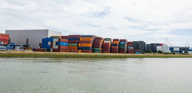Netherlands Rotterdam July 9, 2024 - Cargo terminal at the freight and industrial port of Rotterdam. Stacked different containers, waiting for onward transport.