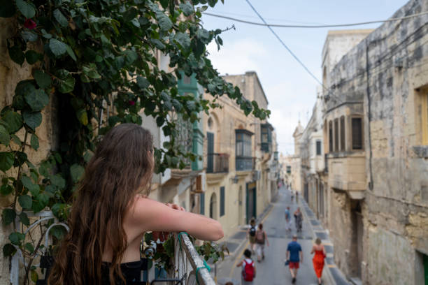 istock Woman explores old town streets, Rabat 2165725044