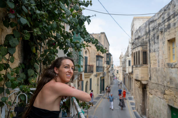 istock Woman explores old town streets, Rabat 2165725085