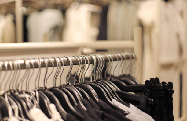 istock Clothes hangers in a shop 2165728665