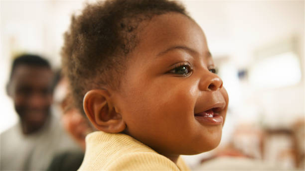 Happy Baby Smiling in Indoor Environment During Daytime
