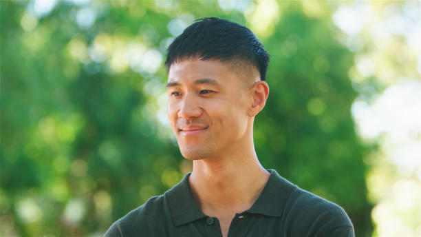 istock Young Man Smiling in Nature During Daytime 2165731278