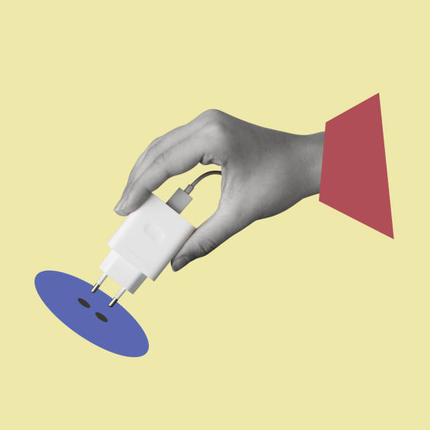 istock Contemporary art collage of hand holding plug socket. 2165733620