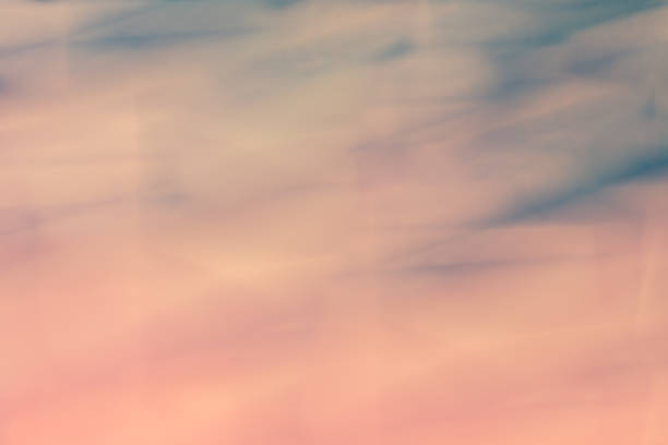 Abstract gradient background in soft pink and blue shades.