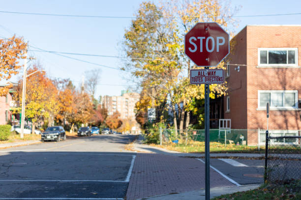 Red stop sign on a road at an intersection in Ottawa, Canada