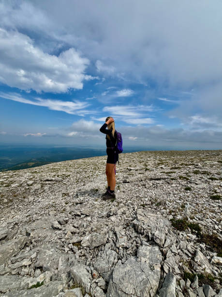 istock Woman Hiking - Standing and Looking on Mountain 2165738354
