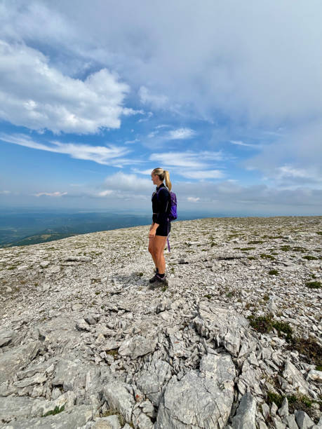 istock Woman Hiking - Standing and Looking on Mountain 2165738355