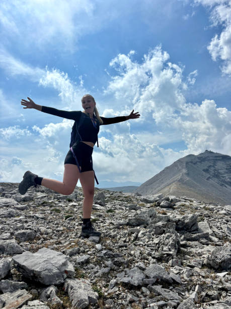 istock Woman Hiking - Posing on Mountain 2165738358