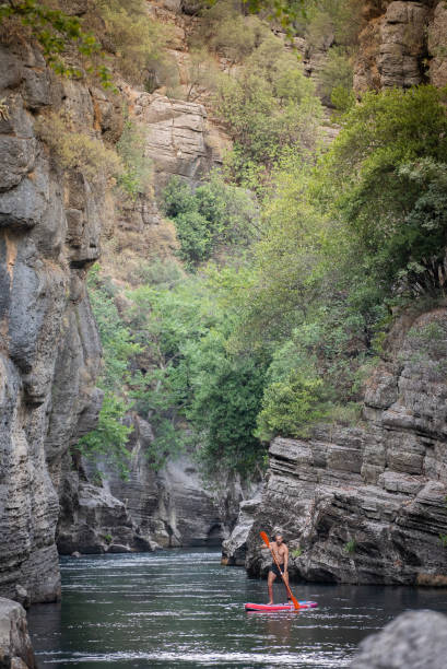 Mature men floating on SUP in Canyon Beşkonak ,Antalya