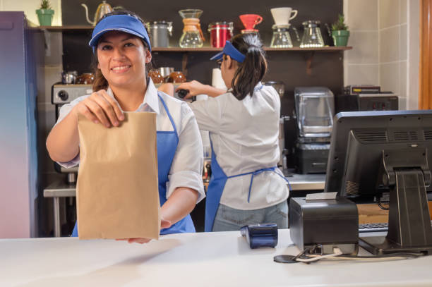 istock Young Latinos, customer service in a coffee shop. 2165741268