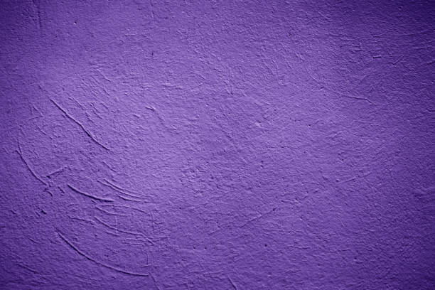 Purple decorative painted plastered wall texture as background
