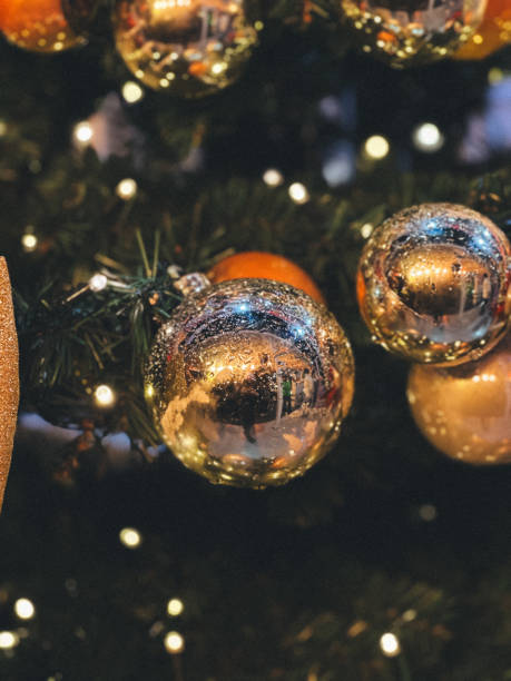 istock A tree with many shiny gold and silver ornaments on it 2165742524
