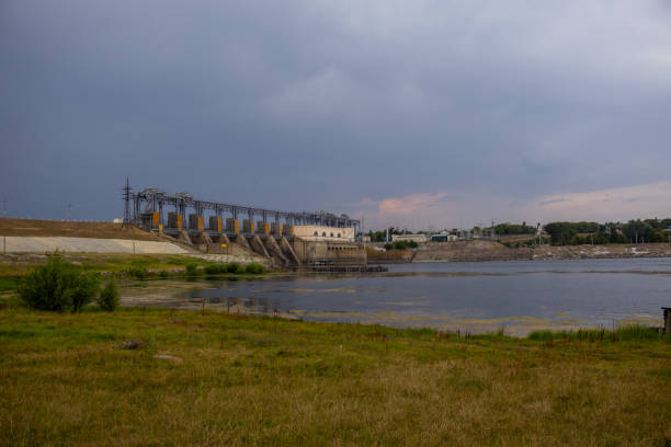 istock An old hydropower plant that flows into the river and all around is green nature 2165743508