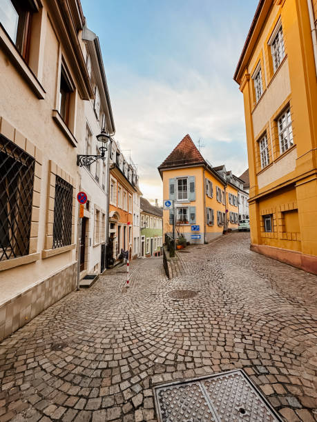 istock A cobblestone street with a blue sign on the side 2165744715