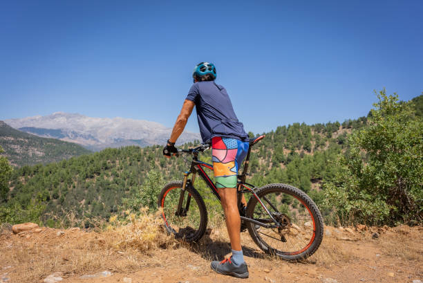 Mountain biker enjoying the mountain view during a rest