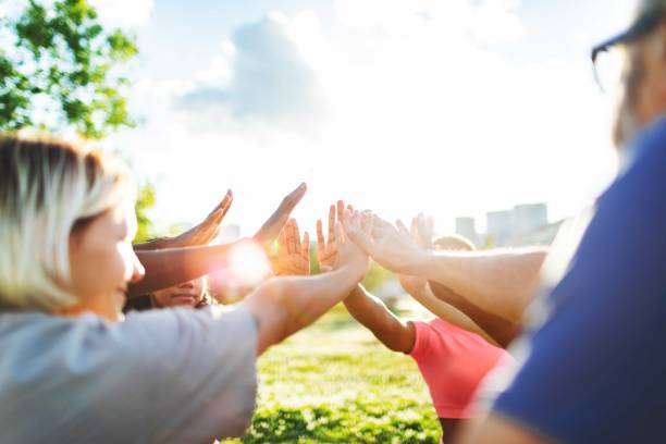 istock People relaxing after sport training, team building 2165752543