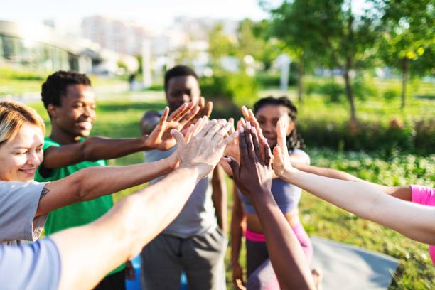 istock People relaxing after sport training, team building 2165752556