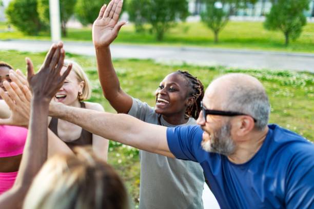 istock People relaxing after sport training, team building 2165752558