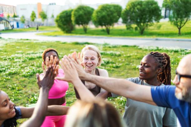 istock People relaxing after sport training, team building 2165752574