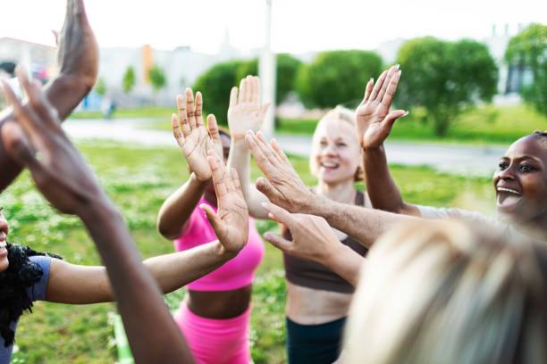 istock People relaxing after sport training, team building 2165752581
