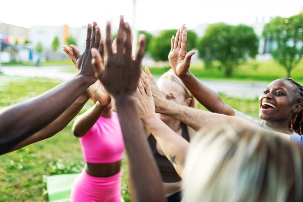 istock People relaxing after sport training, team building 2165752606