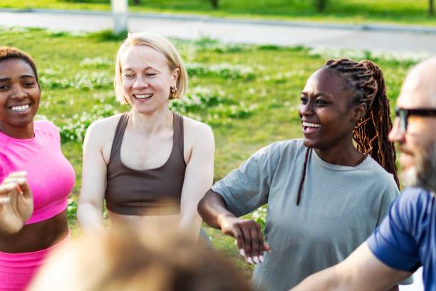 istock People relaxing after sport training, team building 2165752617