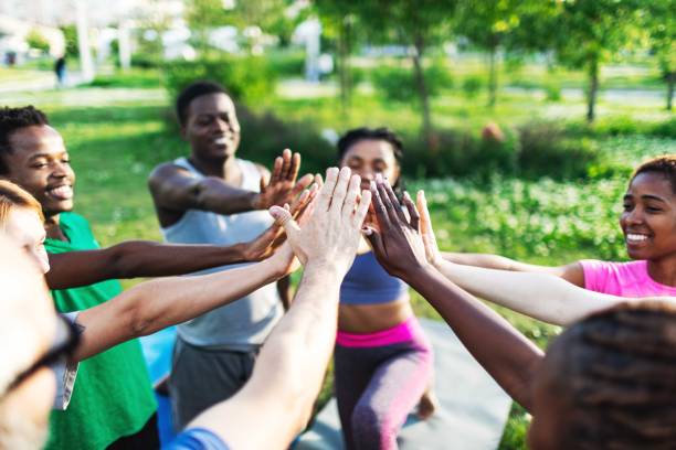 istock People relaxing after sport training, team building 2165752620
