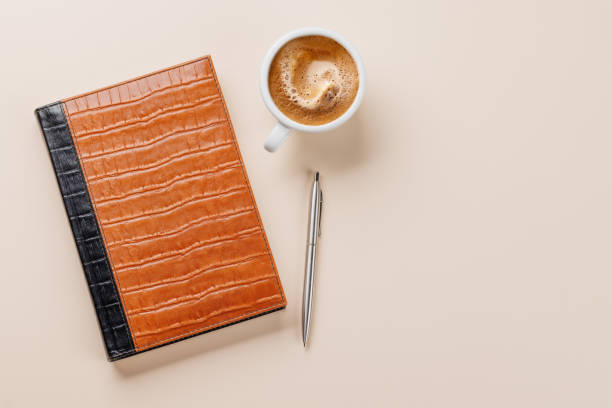 istock Office desk table with notepad, cup of coffee and supplies 2165756562
