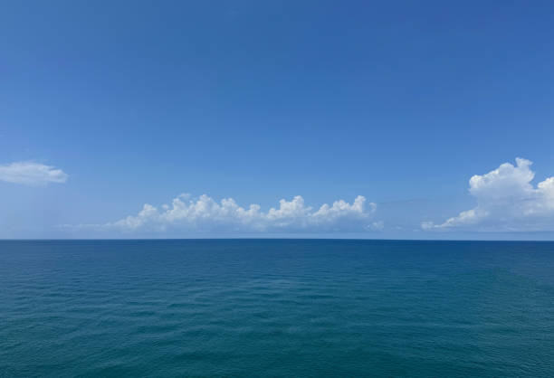 istock Blue sea calm water and white clouds in the sky. 2165757308