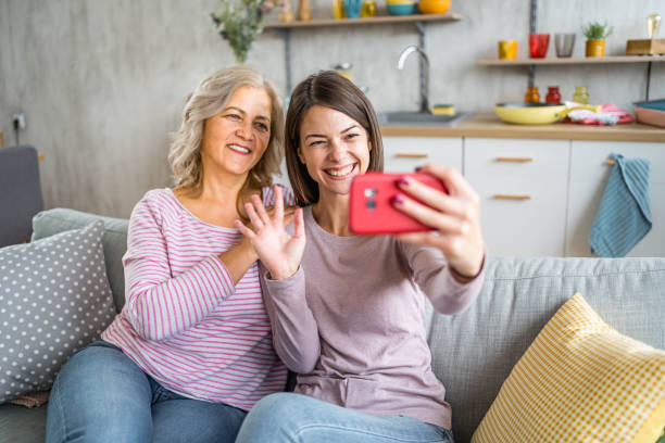 istock Mother and daughter having a video call 2165757321