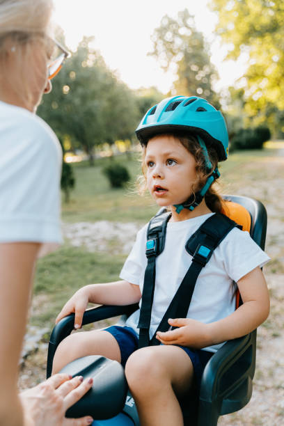 istock Mother and son ryding a bycicle together 2165759090