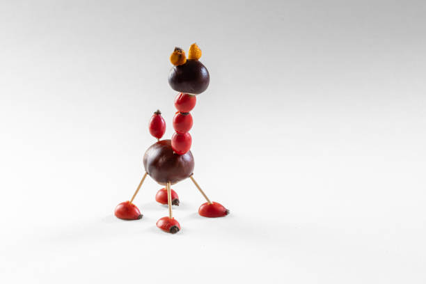 cute figures from autumnal fruits, chestnuts, cones, briar, acorns, berries, isolated