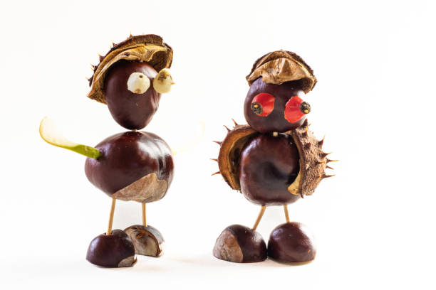 cute figures from autumnal fruits, chestnuts, cones, briar, acorns, berries, isolated