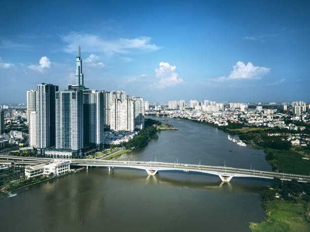 Aerial panoramic view of Saigon, also known as Ho Chi Minh City, with a prominent cityscape and the flowing Mekong River.
