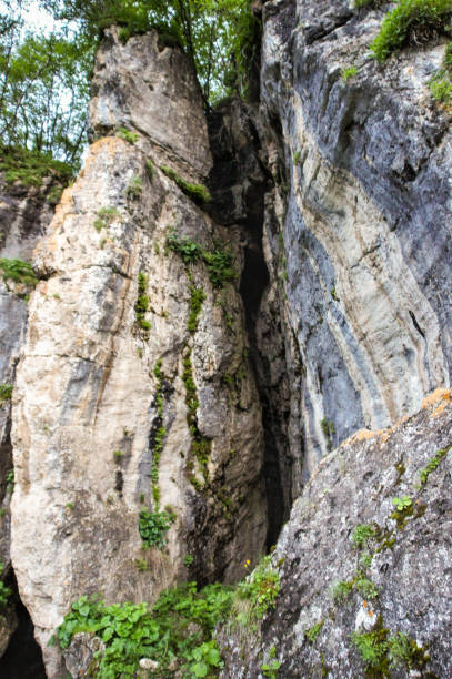 istock A narrow crevice in the rock. 2165763414