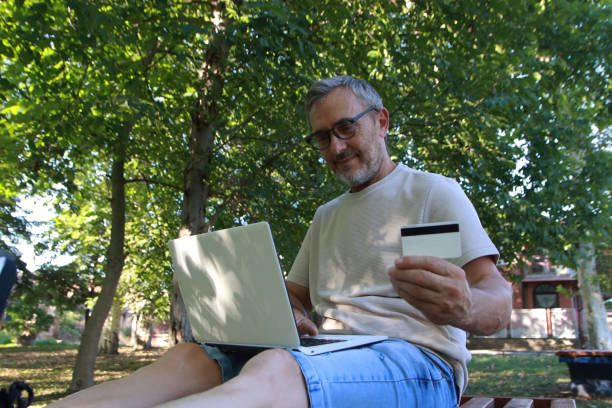 istock Mature man shopping online 2165763766