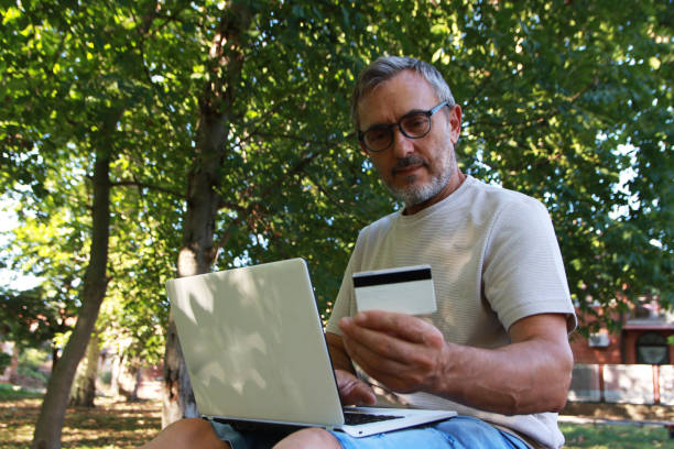 istock Mature man shopping online 2165763843