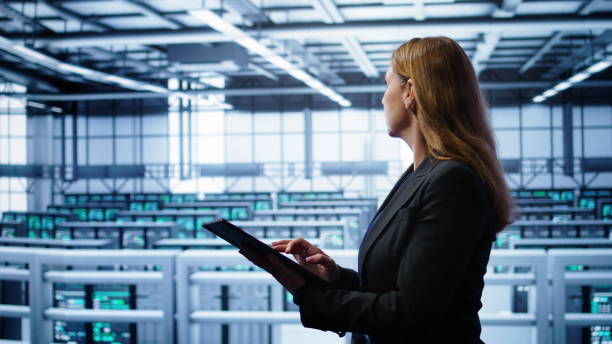 istock Woman working in data center housing advanced data storage infrastructure 2165775818