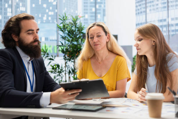 istock Financial advisor in office providing client consultation 2165779650