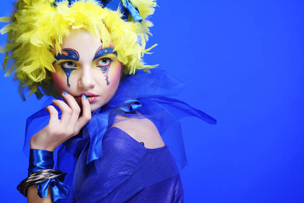 istock woman with yellow wig feather 2165781013