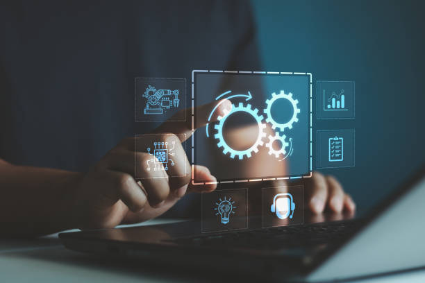istock Robotic process automation concept, RPA, artificial intelligence. Man use laptop with virtual automation technology to automate business tasks with AI. Digital transformation and change management. 2165782768