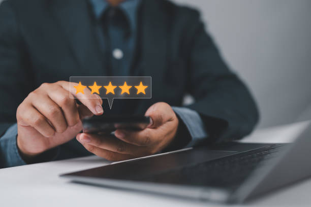 istock Customer satisfaction survey concept. Service experience rating, Satisfaction feedback review, good quality most. Person use smartphone to give excellent five-star ratings on virtual screen. 2165794825