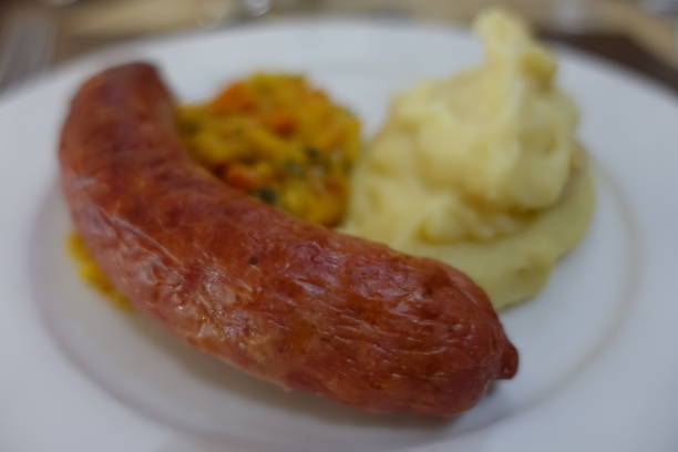 istock Cooked Toulouse sausage served with mashed potatoes and julienne vegetables 2165800674